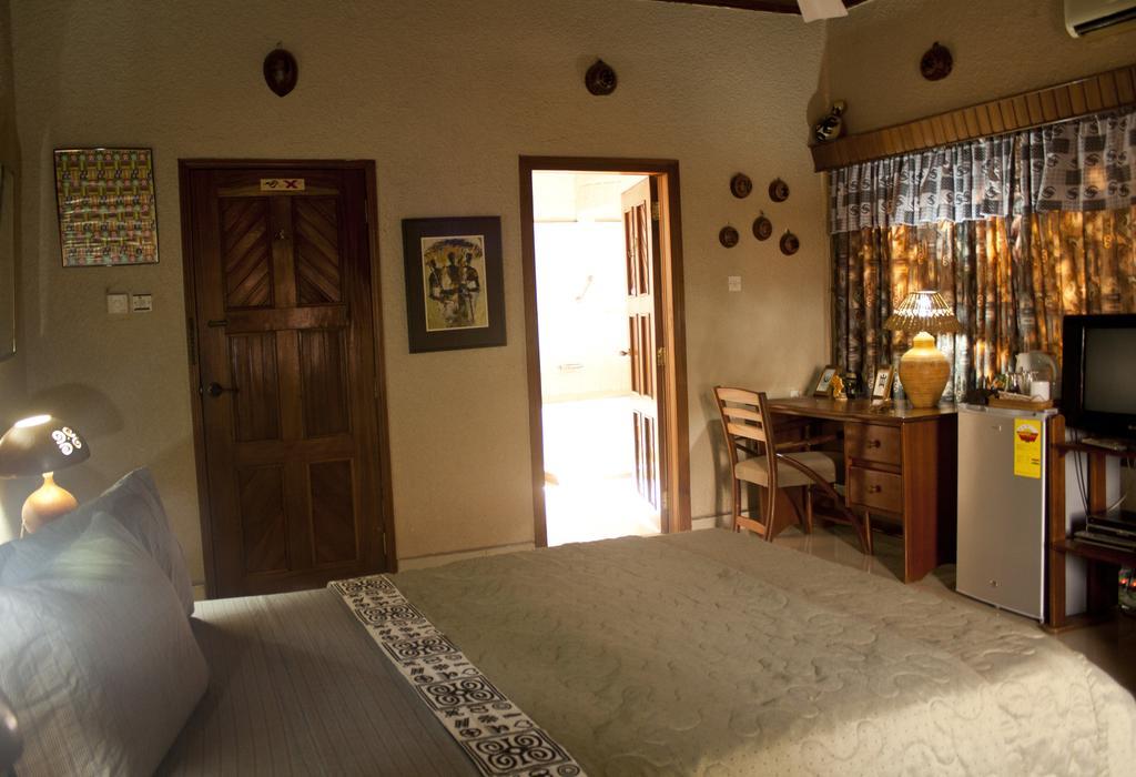 Four Villages Inn Кумаси Номер фото