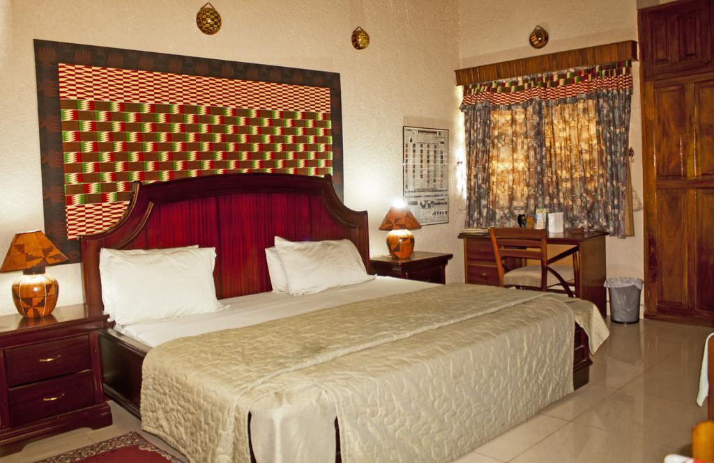 Four Villages Inn Кумаси Номер фото